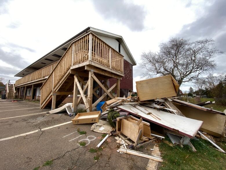 Debris outside a two-storey building.