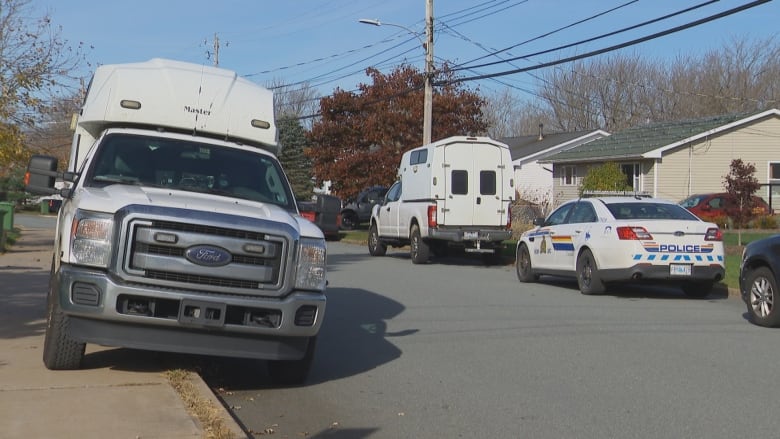 police vehicles parked on the road