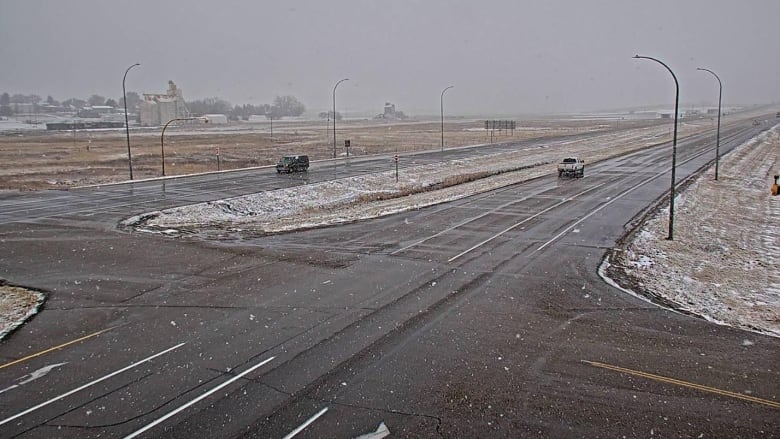 A highway with snow falling near Gull Lake, Sask.