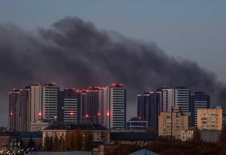 Smoke rises in the sky above the Ukrainian capital of Kyiv, in the aftermath of a Russian drone strike.