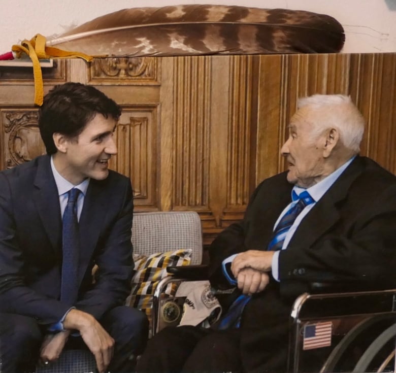 Levi Oakes shaking hands w Prime Minister Trudeau.