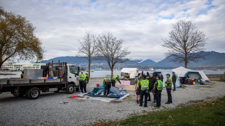 people taking down tents