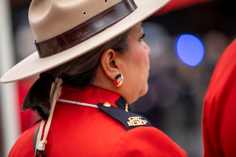 RCMP members are pictured in their red serge dress uniforms on National Indigenous Veterans Day.