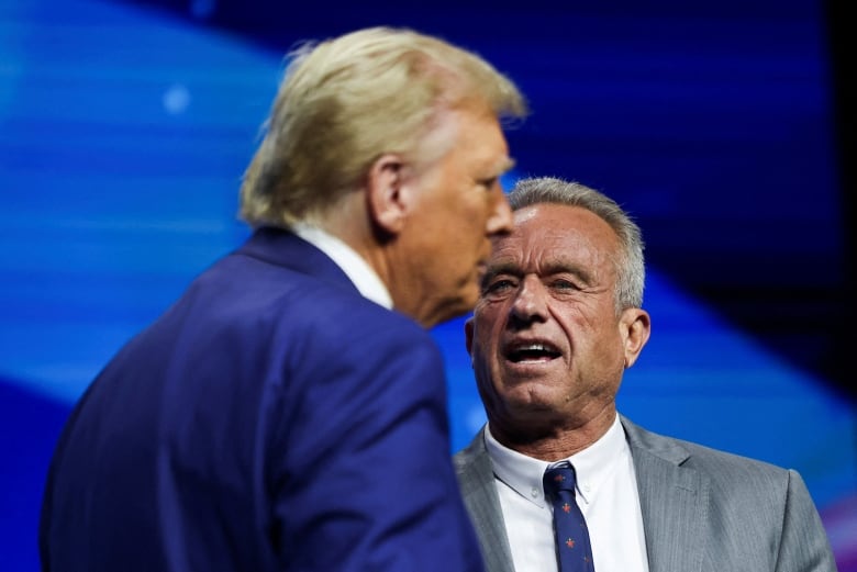 Donald Trump and Robert F. Kennedy Jr. appear on a stage together in Duluth, Ga.