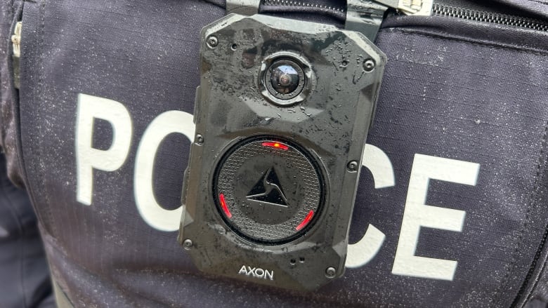 A close-up of an Axon body camera on an RCMP officer's chest. 