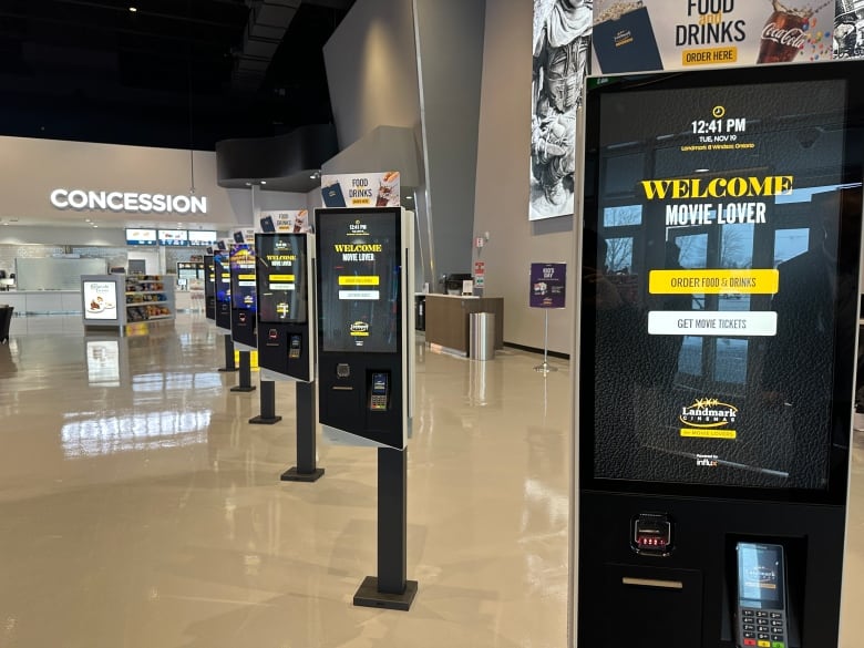 Digital ticket kiosks at a movie multiplex.