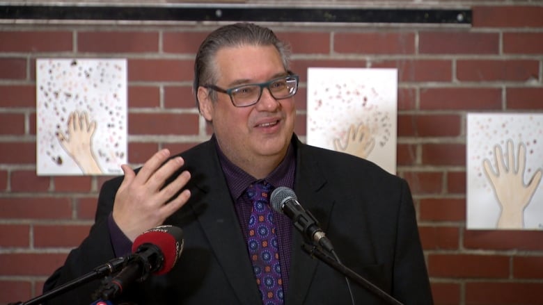 Man speaking at podium