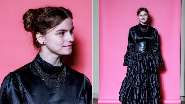 Young woman poses for a portrait wearing dark shiny Victoria dress.