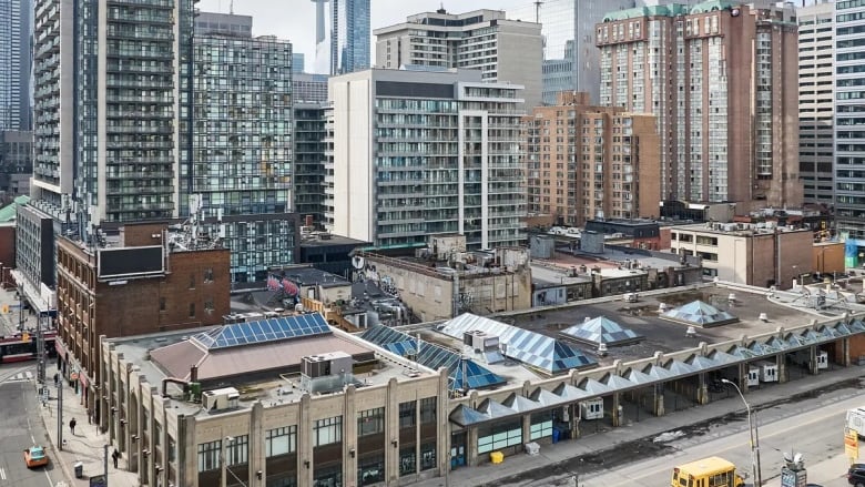 An aerial view showing what the coach terminal looks like, showing a short, wide building with bus ports 