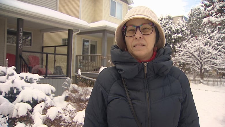 A woman is pictured wearing a winter coat.