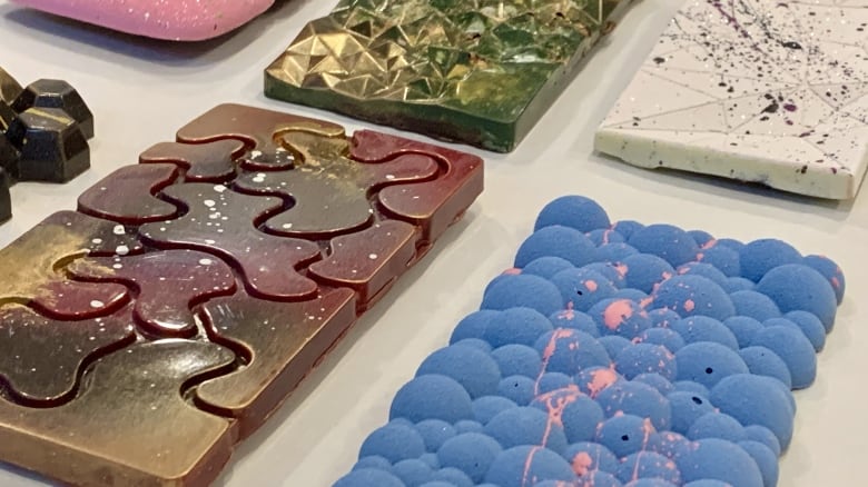 Ornately decorated chocolate bars on display.